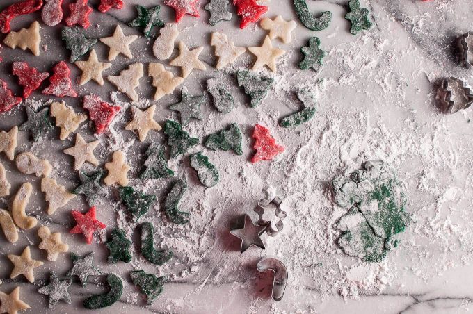 several homemade marzipan Christmas treats with festive cookie cutters