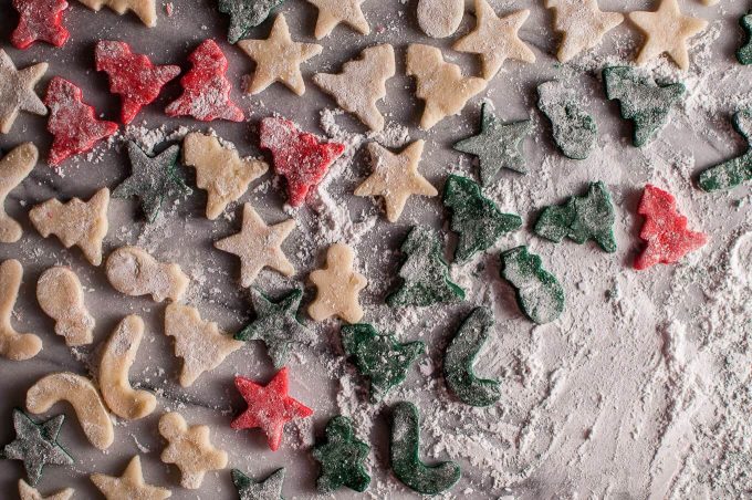 several homemade marzipan Christmas treats with powdered sugar