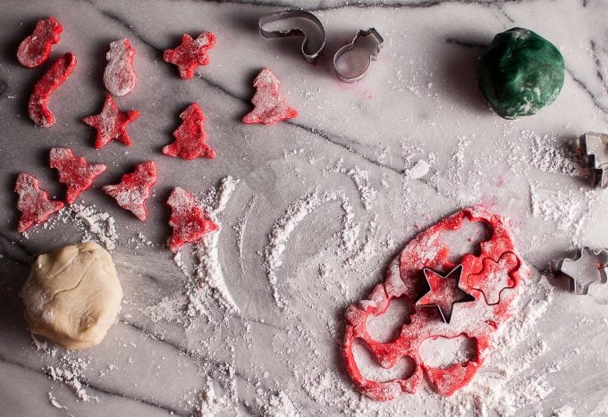 red marzipan dough with festive shaped cookie cutters