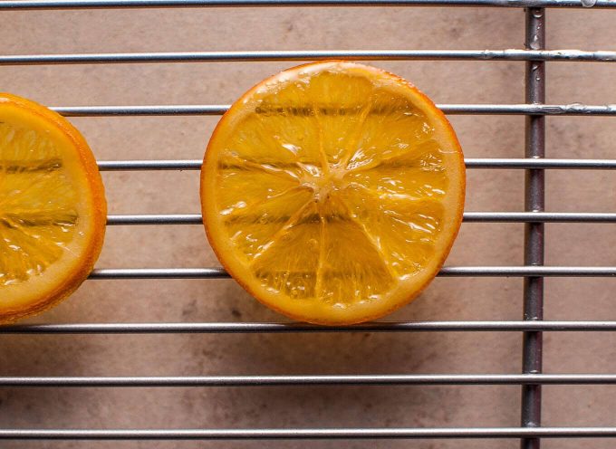 close-up of a candied orange slice on a wire rack