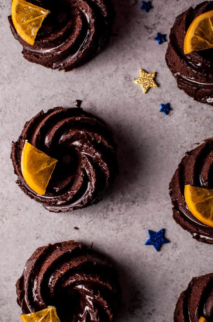 close-up of mini chocolate bundt cakes beside star confetti