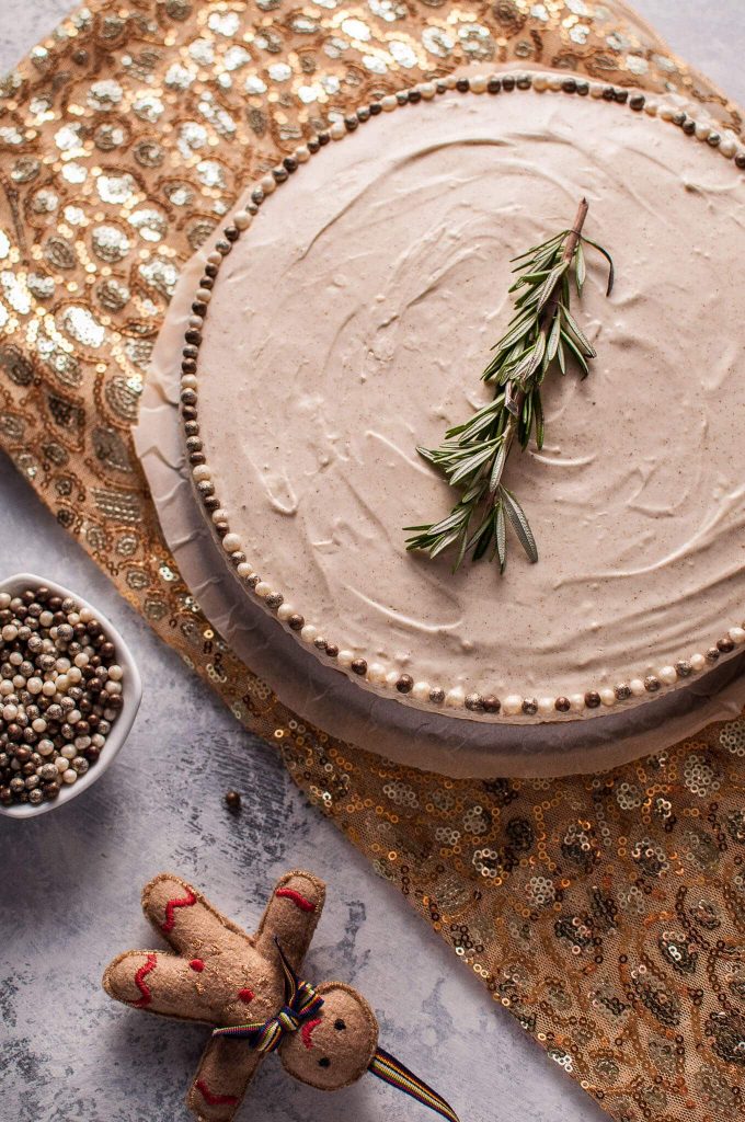 whole no-bake gingerbread cheesecake next to gingerbread man ornament