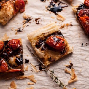 My roasted tomato puff pastry appetizer with a balsamic drizzle is a flavorful vegetarian appetizer that will please a crowd!