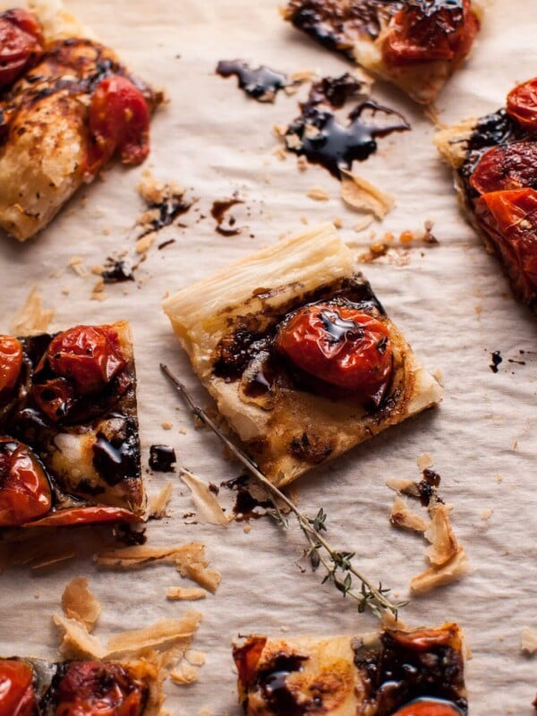 My roasted tomato puff pastry appetizer with a balsamic drizzle is a flavorful vegetarian appetizer that will please a crowd!