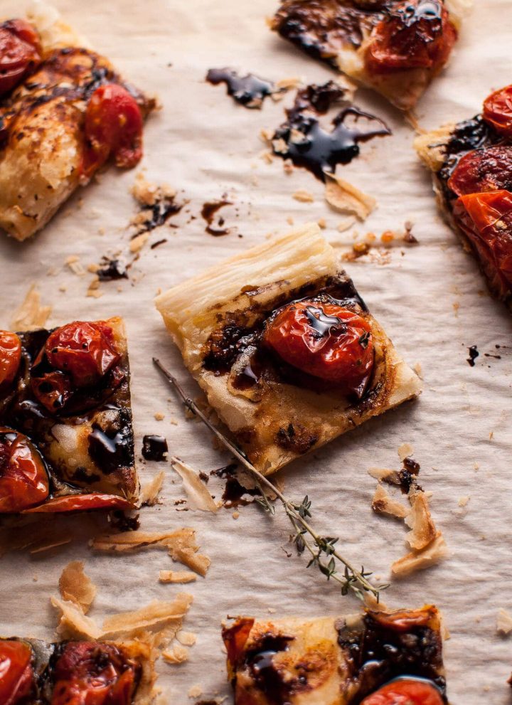 My roasted tomato puff pastry appetizer with a balsamic drizzle is a flavorful vegetarian appetizer that will please a crowd!