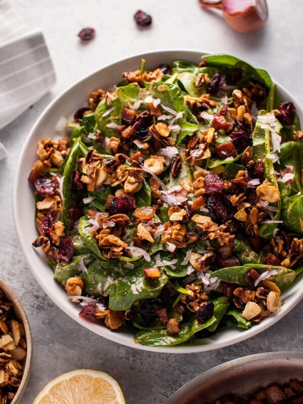 Spinach salad with crispy pancetta and candied nuts is a hearty winter salad that will satisfy your sweet and salty cravings.