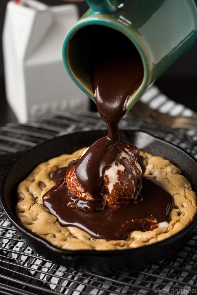 close-up of chocolate chip cookie skillet with chocolate drizzle