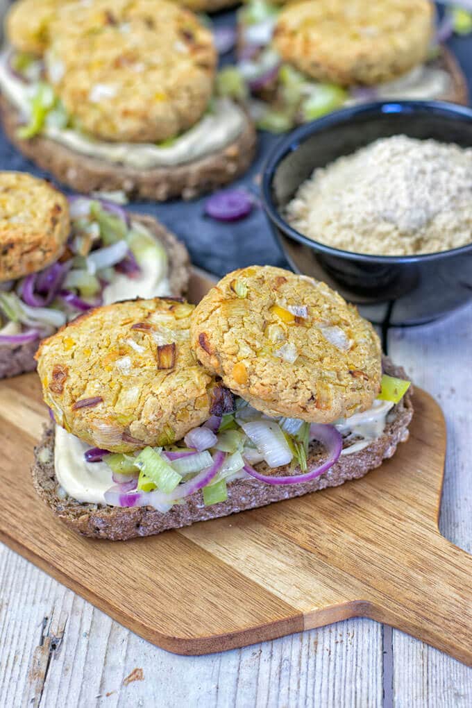 garlic vegan cheese tartine on a wooden board