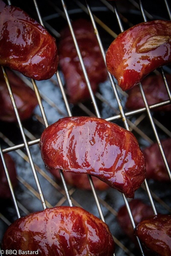 close-up of smoked pork cheeks on a wire rack