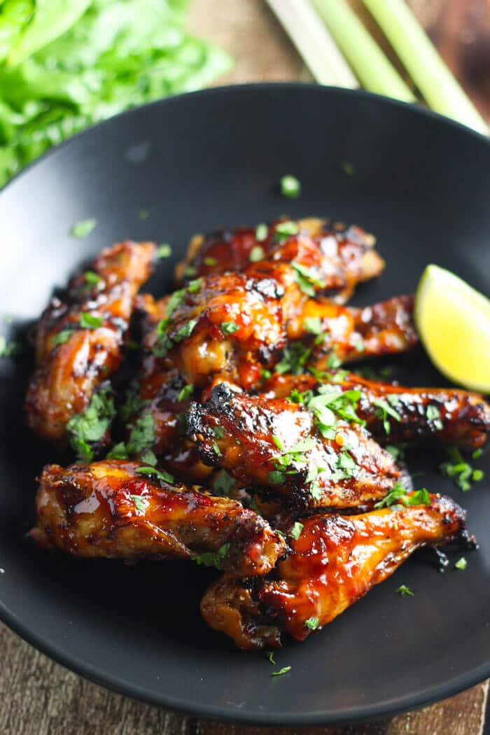 close-up of Vietnamese chicken wings on a black plate