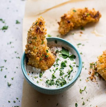 These baked sticky lemon chicken tenders with a quick homemade ranch dipping sauce can be on your table in less than half an hour!