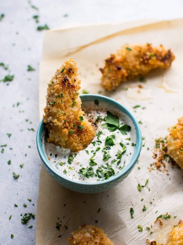 These baked sticky lemon chicken tenders with a quick homemade ranch dipping sauce can be on your table in less than half an hour!