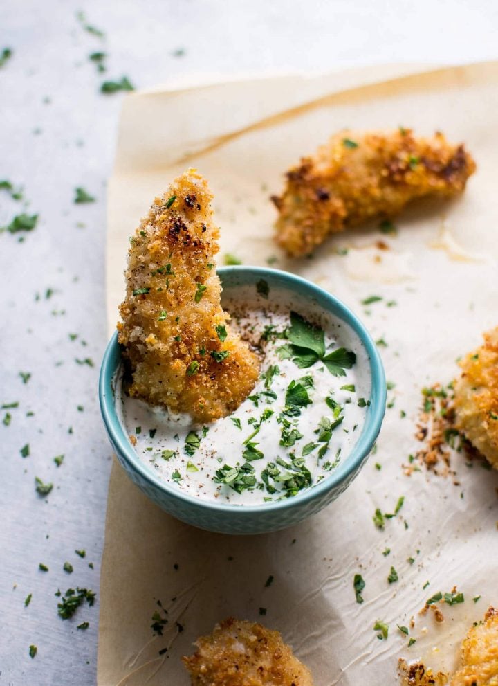 These baked sticky lemon chicken tenders with a quick homemade ranch dipping sauce can be on your table in less than half an hour!