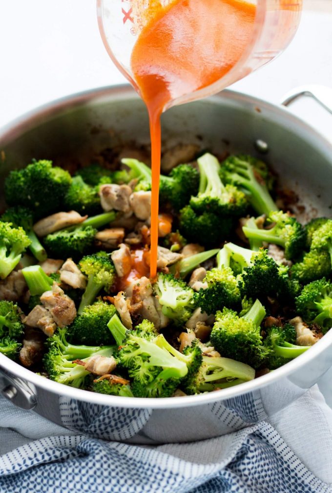 metal skillet with buffalo chicken and broccoli