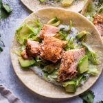 My healthy baked salmon tacos are fresh and full of flavor and ready in under 30 minutes. The cilantro lime Greek yogurt dressing tastes just as good as sour cream but contains fewer calories.