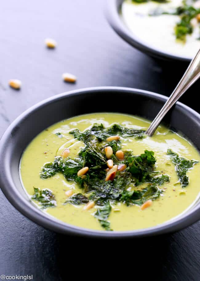 bowl of roasted cauliflower and kale soup with spoon