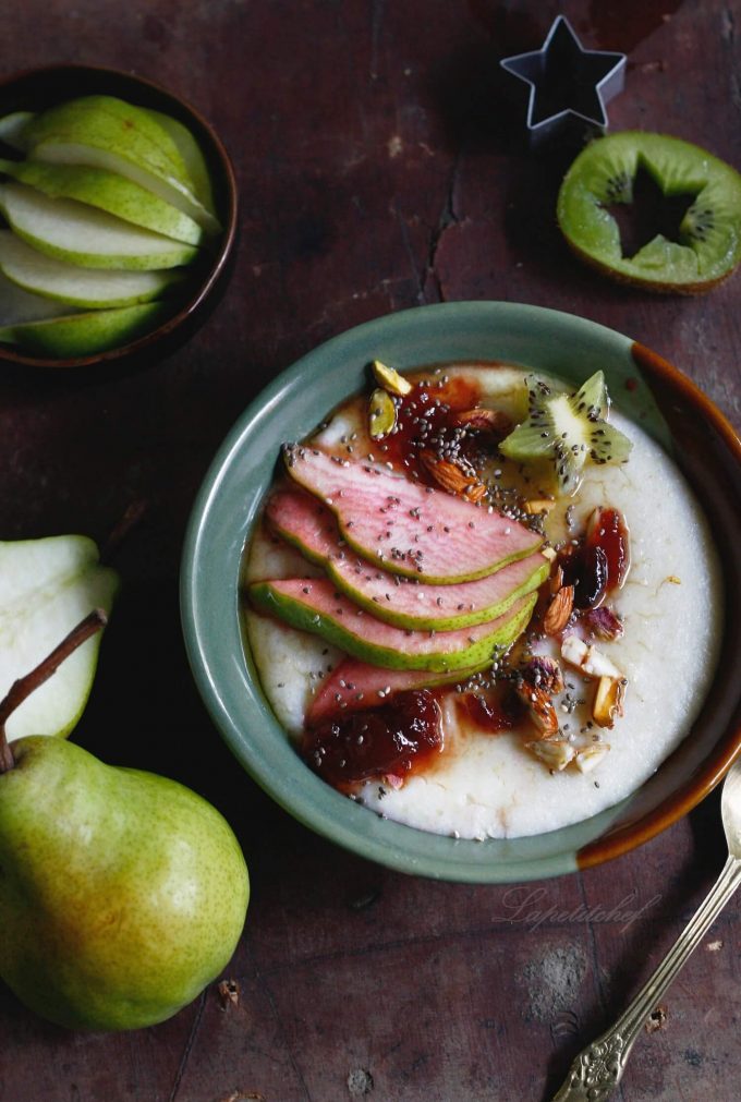 vegan millet porridge in a bowl with apple slices and a pear