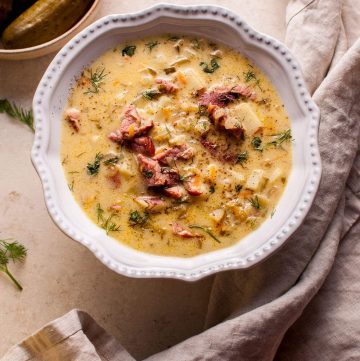 Polish dill pickle soup with smoked ham is a hearty, savory, creamy, and comforting dish. A big pot of it can be on your table in only 45 minutes!