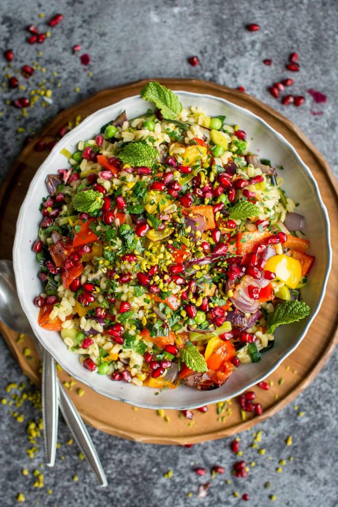 wheat berry risotto with roasted vegetables in a white bowl