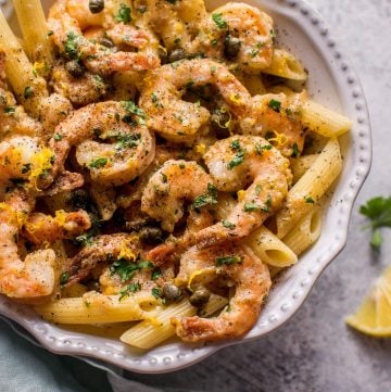 This quick and easy shrimp piccata recipe is ready in under half an hour. Succulent shrimp are cooked in a lemon-butter-caper sauce and served over penne.