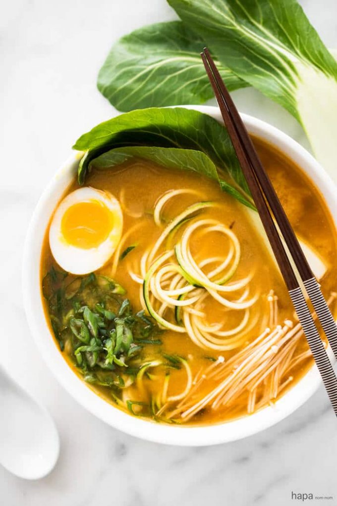 spicy miso zucchini ramen noodles in a bowl with chopsticks