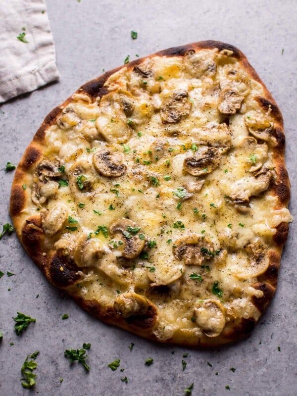 This vegetarian truffled mushroom naan pizza is super easy, a little fancy, and tastes way better than you'd expect from a quick homemade pizza!