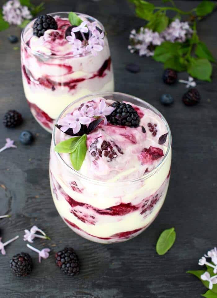 two glasses with berry tiramisu trifles