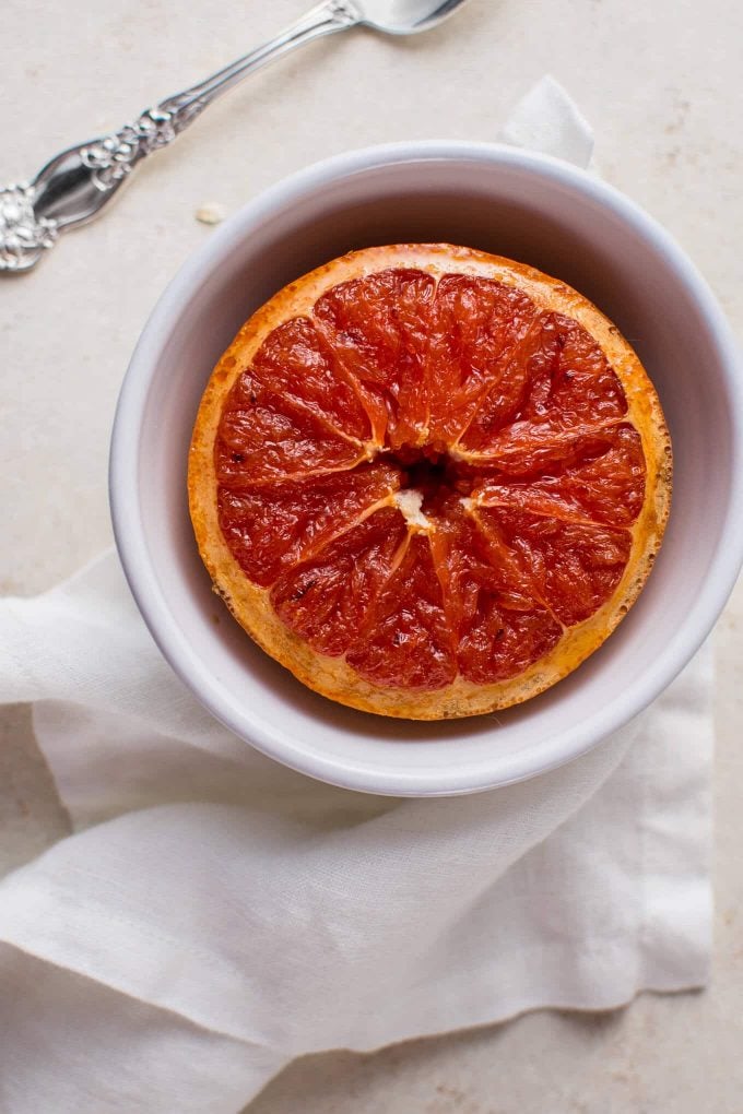 close-up of half a caramelized grapefruit in a bowl