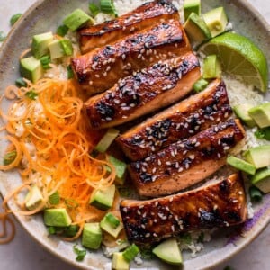 This glazed hoisin and sesame salmon bowl is a delicious low-carb meal idea, served on a bed of cauliflower rice.