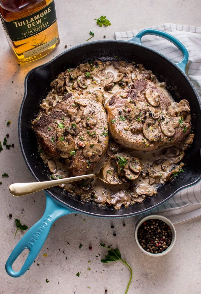 pork chops with an Irish whiskey sauce in a cast iron skillet