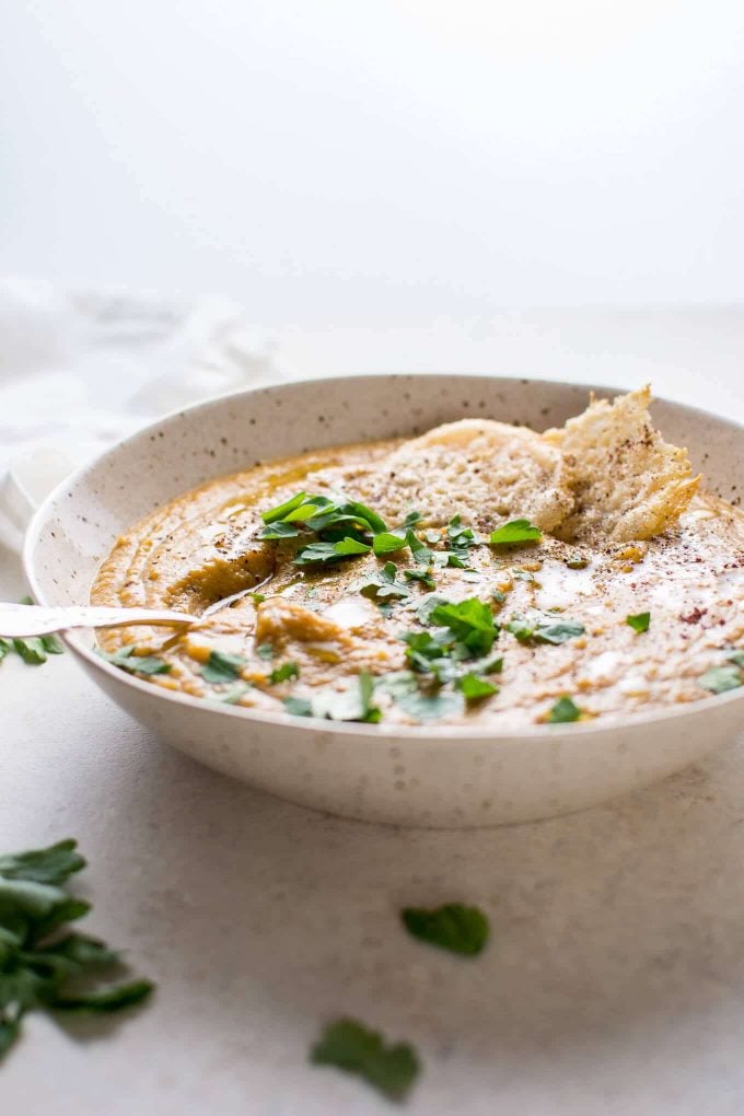 bowl of roasted butternut squash and cauliflower soup with coconut milk