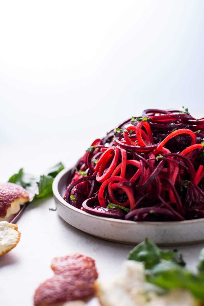 spiralized raw beet salad with blood oranges in a bowl