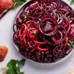 bowl of spiralized raw beet salad with blood oranges