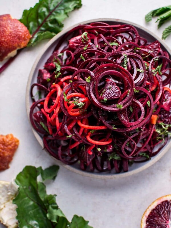 bowl of spiralized raw beet salad with blood oranges