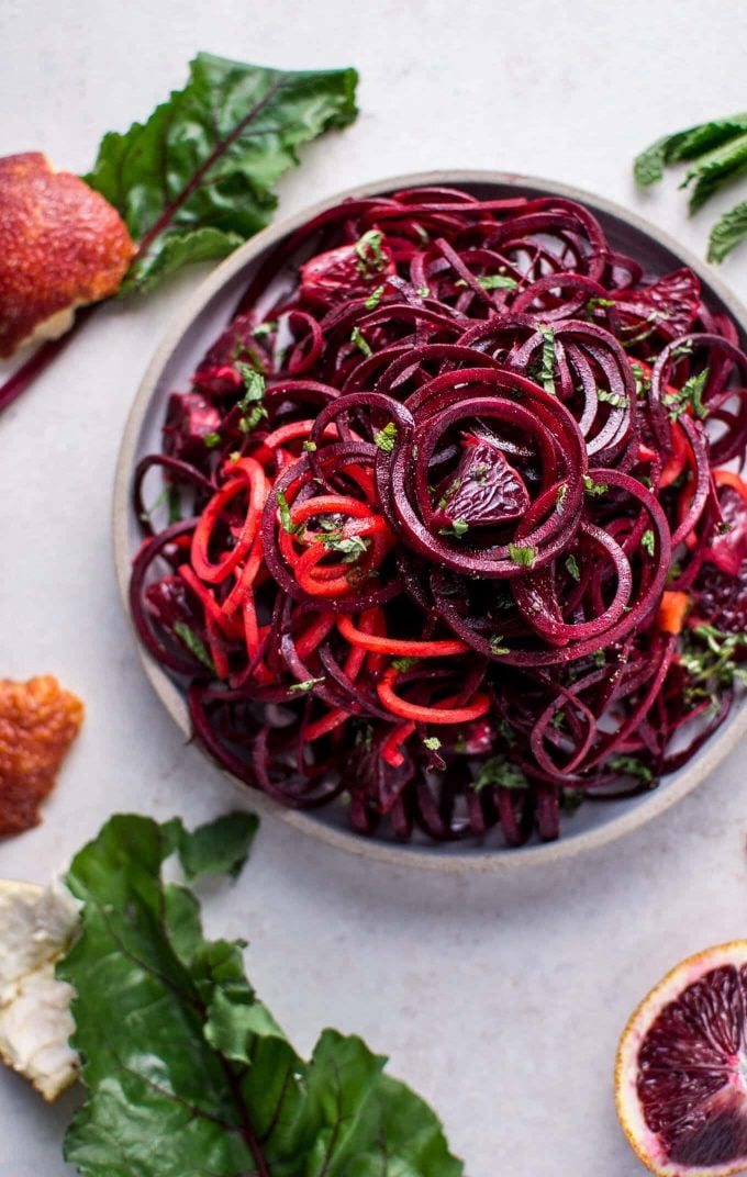 bowl of spiralized raw beet salad with blood oranges