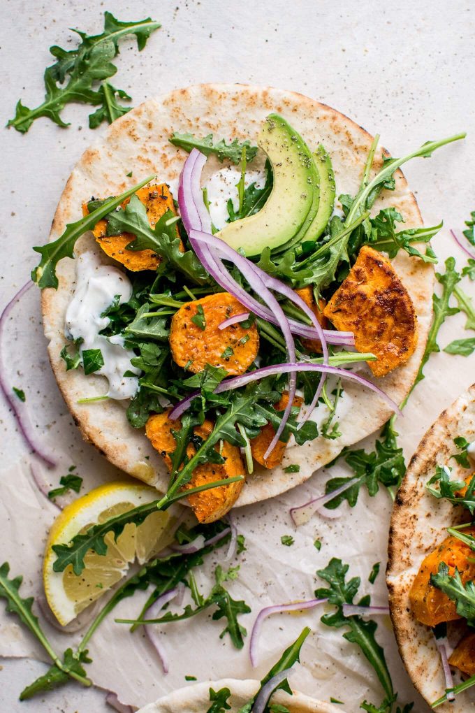 close-up of a roasted sweet potato pita beside a lemon slice