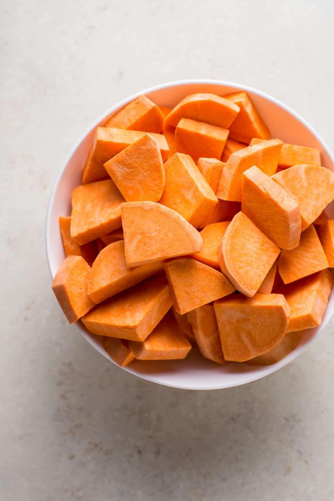 bowl of raw chopped sweet potatoes