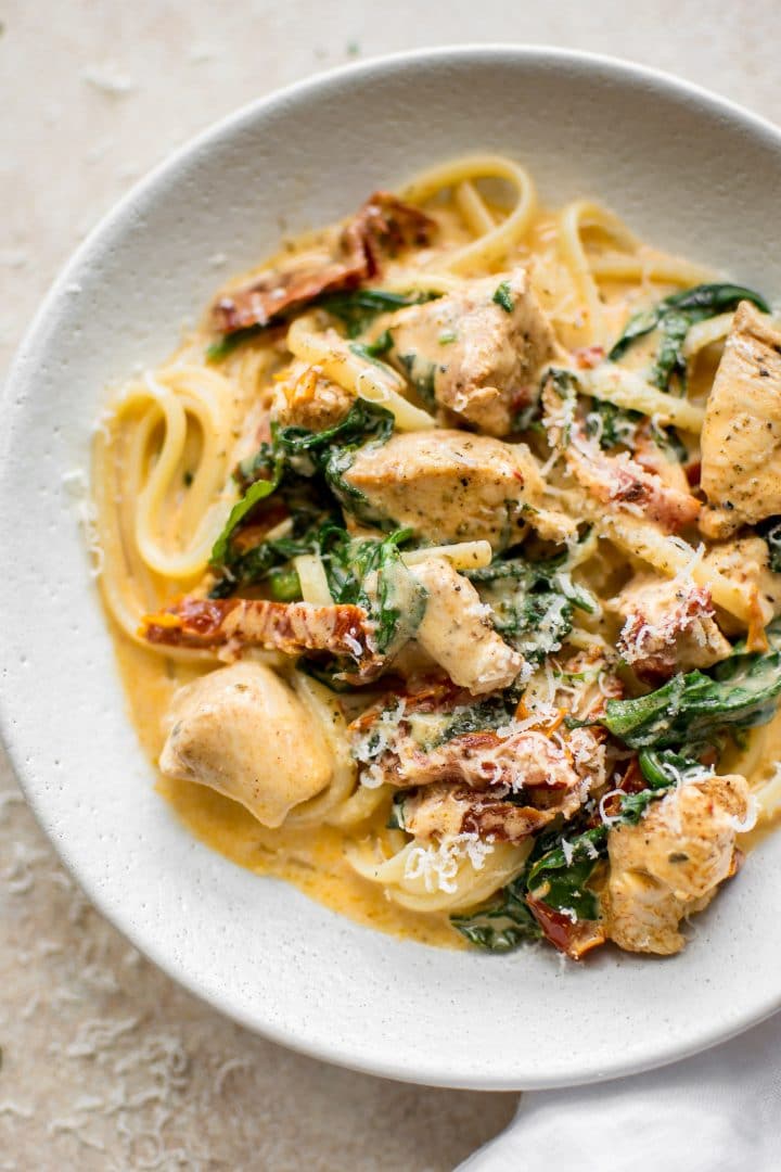 close-up of creamy Tuscan chicken pasta in a bowl