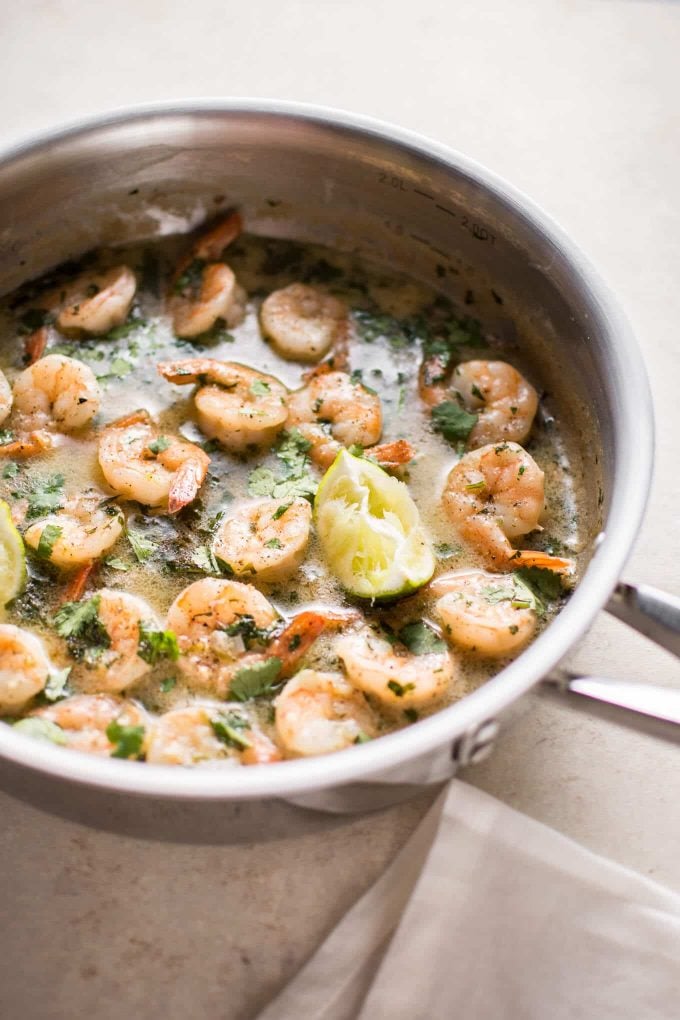 metal skillet with coconut lime shrimp