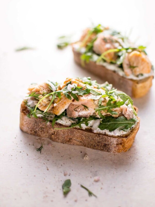 Baked salmon, lemon, crusty bread, fresh dill, Greek yogurt, shallot, and arugula make this salmon tartine one delicious open-faced sandwich! Ready in 20 minutes.