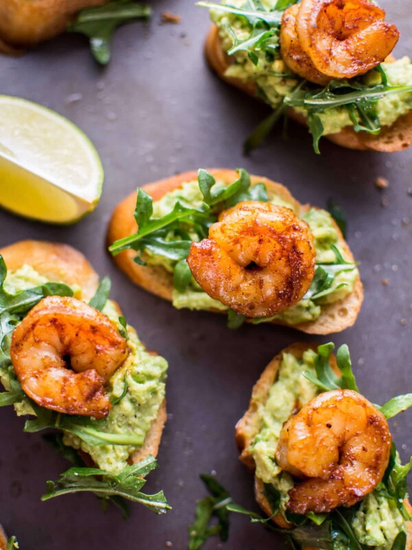 Garlic shrimp and avocado crostini are a fresh and delicious bite-size appetizer that will be a hit at any gathering or party!