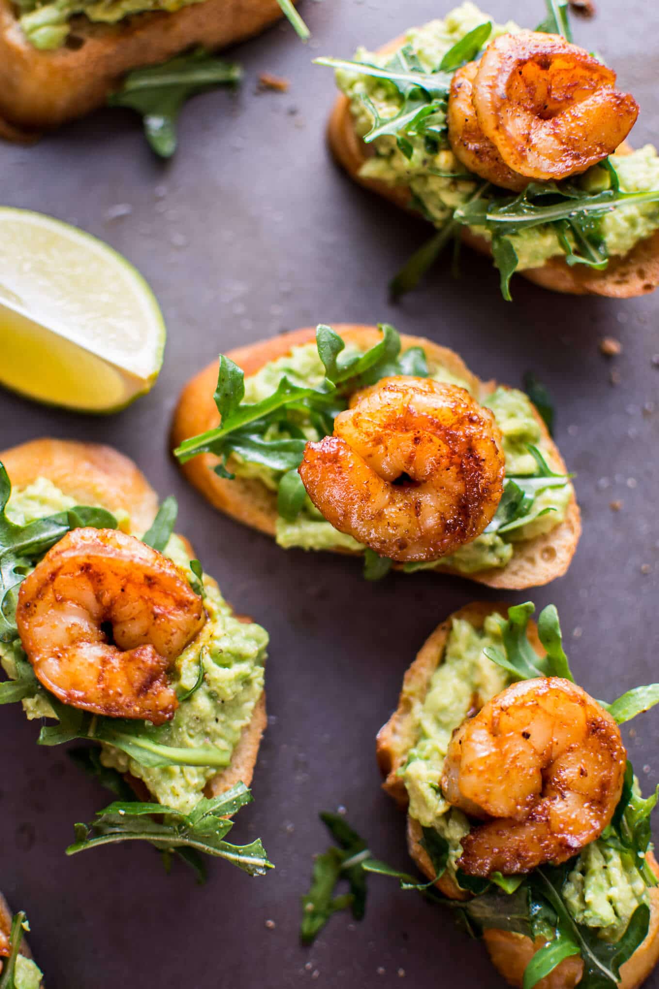 Garlic shrimp and avocado crostini are a fresh and delicious bite-size appetizer that will be a hit at any gathering or party!