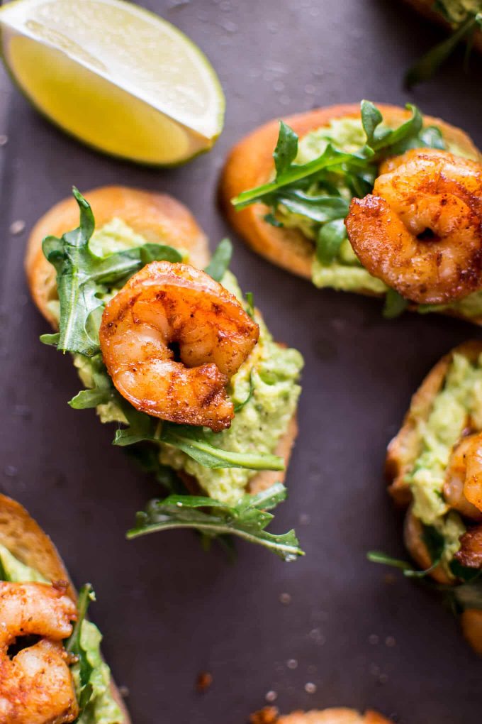 close-up of bite-sized shrimp and avocado crostini appetizer