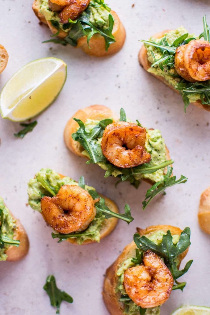 several garlic shrimp and avocado crostini appetizers