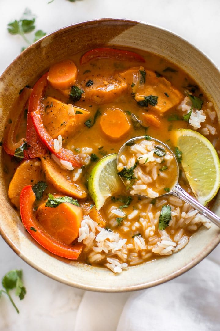 vegan thai coconut sweet potato curry in a bowl with a spoon