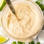 a jar with a spoon and homemade chipotle ranch dressing