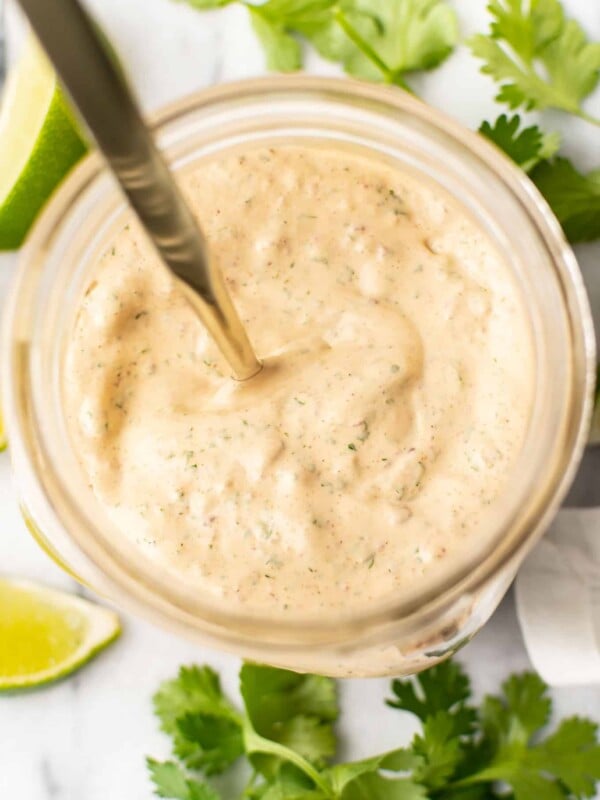 a jar with a spoon and homemade chipotle ranch dressing