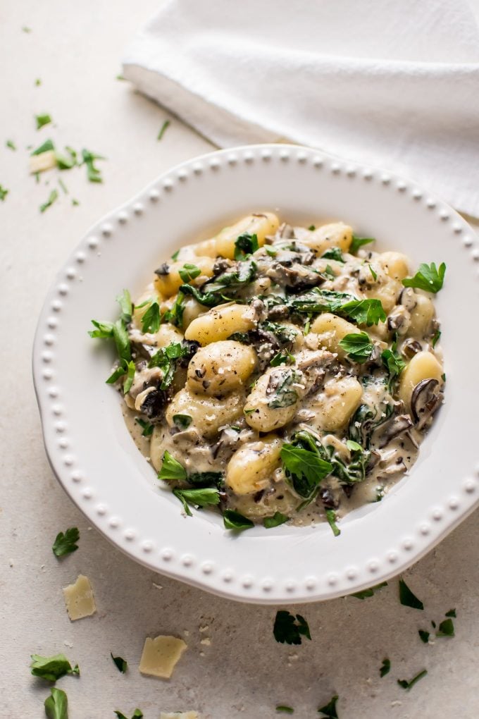 This creamy mushroom and spinach gnocchi is a restaurant-worthy dinner made in one pan and ready in less than 30 minutes!