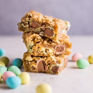 a stack of easter mini egg cookie bars