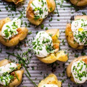 These garlic and lemon smashed potatoes are a fresh and flavorful side dish or party finger food. Replacing sour cream with Greek yogurt also makes these healthier!